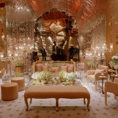 The main hall for the Sufi night, featuring a spectacular mirrored archway that reflects the candlelight beautifully. We used plush, low seating in pastel tones to create a comfortable and opulent lounge feel.