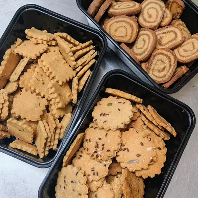 A top-down view of my three signature cookie varieties: the sweet and salty Jeera Cookies, the stunning Marble Cookies, and the super healthy Multiseed Cookies. All are 100% eggless and made with whole wheat.