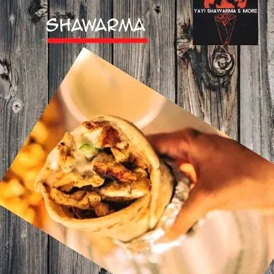 A promotional graphic I use for my brand, Yay! Shawarma & More. It features a hand holding a generously filled shawarma roll, ready to be enjoyed.
