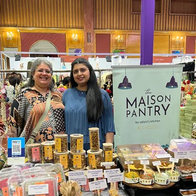 Posing proudly at my stall during the Jalsa exhibition. It brings me so much joy to stand behind my creations and share them with everyone who visits.