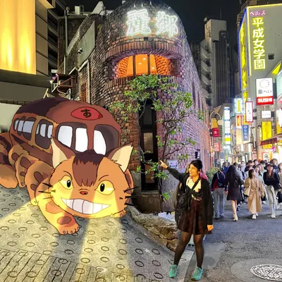 Here I am in Japan, with the Catbus from 'My Neighbor Totoro' illustrated right onto the street. This is how I combine my love for travel, art, and anime.