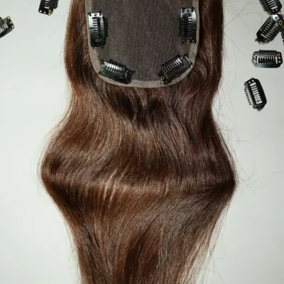 This is a close-up of one of my hair toppers, designed to give you confidence starting from the crown. You can see the secure clips and the natural-looking scalp base.