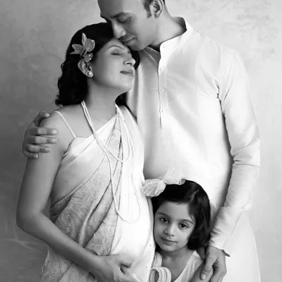 A timeless black and white version of a beautiful maternity portrait. Removing the color emphasizes the serene expressions and the deep connection of this growing family.