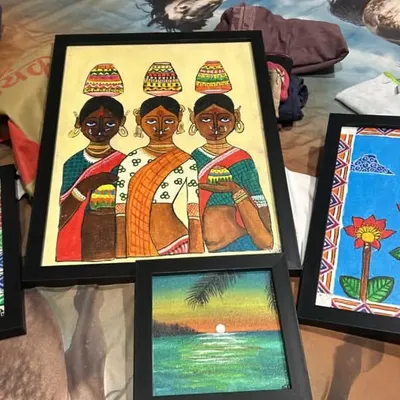 A collection of framed Madhubani paintings on canvas by Adhya, an 11th standard student. Her work includes traditional motifs like fish, lotuses, and working women, all done in the authentic folk style.