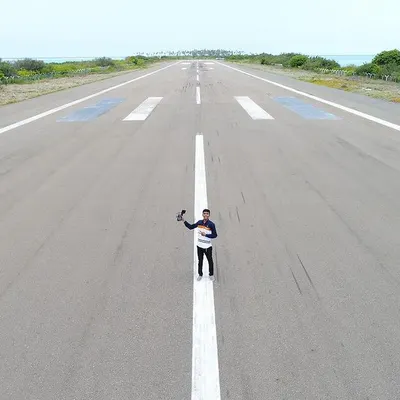 Aakela hi kafi ho. Sometimes it's just me, my drone, and an entire runway to myself on Agatti Island, Lakshadweep. This shot gives a sense of the scale and adventure involved in getting that one perfect aerial shot.