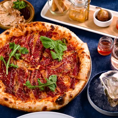 A true feast. Our Neapolitan-style New Yorker Pizza, fresh oysters on ice, and a charcuterie spread create a table that’s meant for sharing and celebration. This is what dining at Lupa is all about.