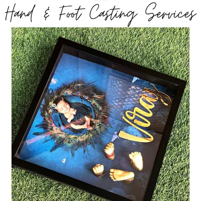 An overview of our Hand & Foot Casting service. This framed piece combines a beautiful newborn portrait with 3D casts of the baby's hands and feet, personalized with their name.