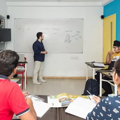 A snapshot of a live classroom session. Our trainers guide students through concepts on the whiteboard, encouraging active participation and discussion.