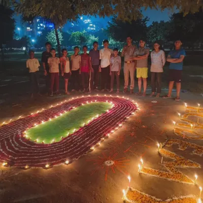 My students are my family. This photo captures our annual Diwali celebration, where we trade the training ground for a moment of community and light. It's all about the bond we build.