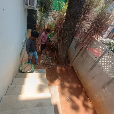 Before the transformation: a cluttered and unused space at the bottom of a staircase. This is the starting point for a new pathway and garden.