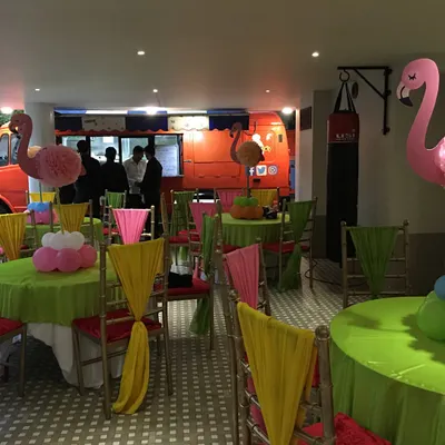 Here is a wide view of an indoor birthday party setup. You can see how my food truck integrates seamlessly into the event space, providing a unique and exciting focal point for guests.