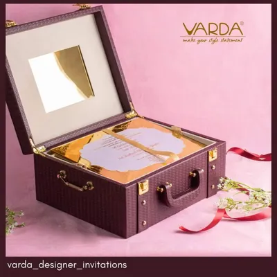 This anniversary invitation is designed as a sophisticated briefcase-style keepsake box. The rich, textured exterior and custom-fitted interior for the acrylic invite make it a truly luxurious and memorable announcement for a milestone celebration.