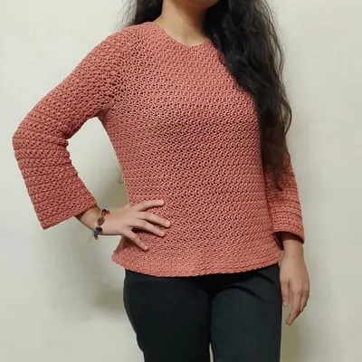 This is the Etoile Sweater, one of my favorite pieces to make. I love how it fits, and the star-stitch detail on the sleeves makes it so unique. We can create this custom handmade sweater for you in any color you like.