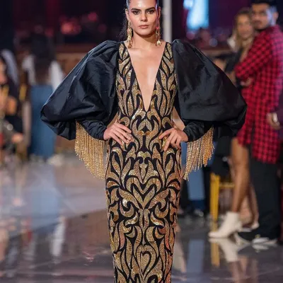 A powerful runway look for Abu Jani Sandeep Khosla at the Jio World Plaza launch. The makeup is bold and defined to match the dramatic silhouette of the gown, featuring sharp contouring and striking eyes.