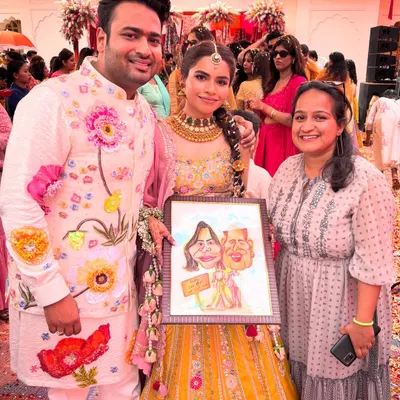 A beautiful couple with their framed caricature on their special day. This is more than a gift; it's a personalized piece of art to remember their wedding.