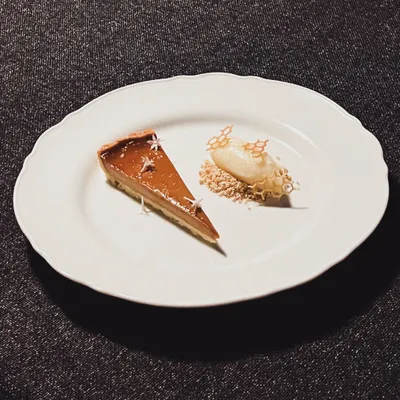 A classic with a twist: my Caramelised Muscovado Custard Tart. It's served with a scoop of house-made cinnamon ice cream for a warm and comforting finish.