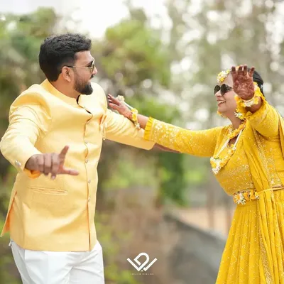 Pure fun and energy during a Haldi ceremony, with the couple dancing and enjoying the moment.