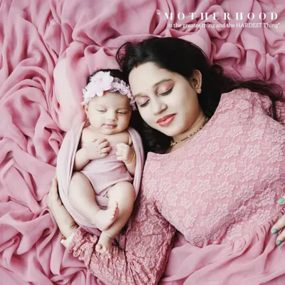 After the bump comes the baby. This tender portrait of a mother holding her newborn close is the beautiful culmination of the maternity journey, a world of love held in her arms.