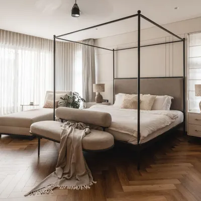 The focal point of this master bedroom is the stunning four-poster bed. The clean lines and dark frame create a modern canopy, while the soft, muted tones of the bedding and herringbone wood floor add warmth and gentle opulence.