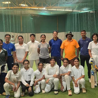 A snapshot of our dedicated girls' cricket team during a practice session in the nets. The focus and camaraderie here is what makes our academy special.