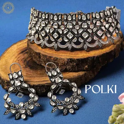 Why repeat when you can rent? This stunning Polki choker and earring set with a modern black finish is perfect for making a bold statement at a cocktail party or reception.