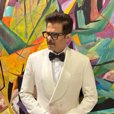 A classic black-tie look for Anil Kapoor at the IIFA awards. The hairstyle is sharp, clean, and sophisticated, perfect for a formal event.
