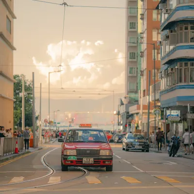 An iconic red taxi in Hong Kong, bathed in the warm glow of the afternoon sun. The Amber preset enhances the golden light and makes the red of the taxi pop against the urban background.