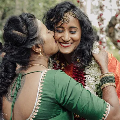 A mother's affectionate kiss for her daughter on her wedding day. This is a perfect example of the emotional, candid moments that I strive to capture, preserving the warmth and love of family.