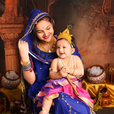 A beautiful moment between an older sister as Yashoda and her baby brother as little Krishna. Capturing sibling love during a festive Janmashtami shoot is truly special.