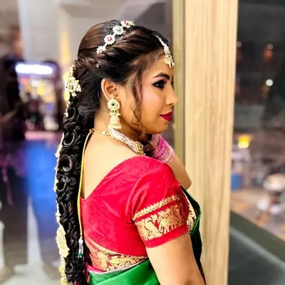 A closer look at a traditional South Indian bridal hairstyle I created. The intricate braid is woven with hair extensions for length and volume, and decorated with classic hair jewelry.