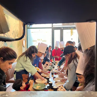 A candid shot of one of my family workshops. It's a full house with kids and parents all getting their hands doughy and learning together.