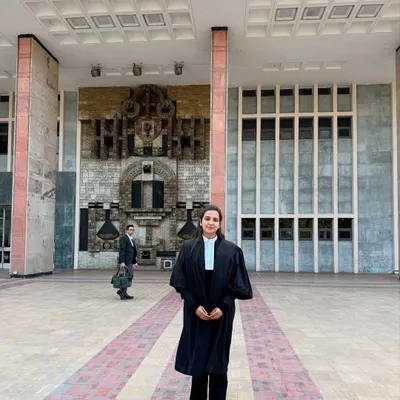 Standing in my advocate's robes outside the Delhi High Court. I am experienced in navigating the procedures and arguing cases within this important jurisdiction.