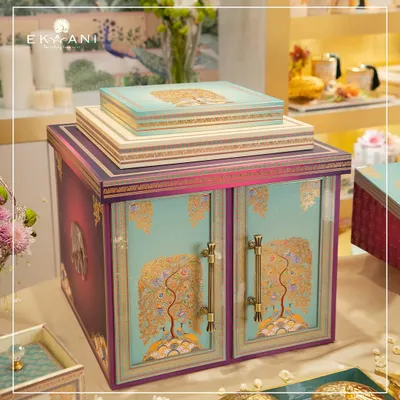 This is the main invitation hamper from the Tree of Life collection. The doors are adorned with the tree motif, and it is designed to be a stunning centerpiece that holds all the coordinated elements of the wedding stationery suite.