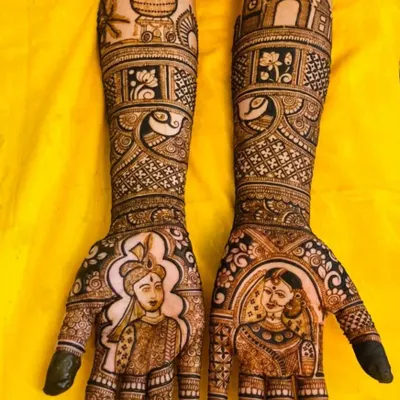 This custom bridal mehendi captures the bride's unique story, blending portraits with architectural symbols from Mangalore and Mumbai, the two cities she calls home.