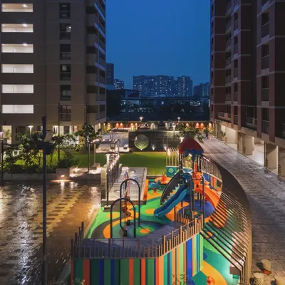 The "Pixelscapes" playground at dusk, where integrated lighting ensures the fun can continue safely after the sun goes down.