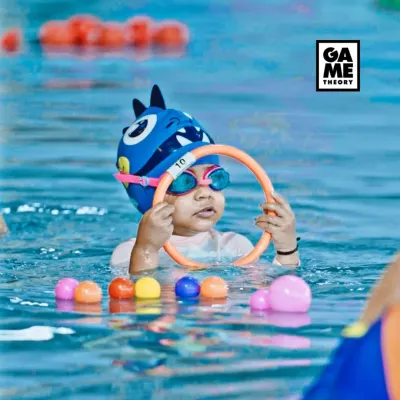 One ring at a time! Our toddler swimming program uses fun games and toys to get your little one comfortable and happy in the water.