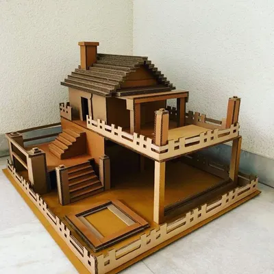 Our modern villa dollhouse kit is a builder's delight. It includes two floors, outdoor patio space, detailed railings, and a staircase, all made from sturdy, slot-together cardboard.