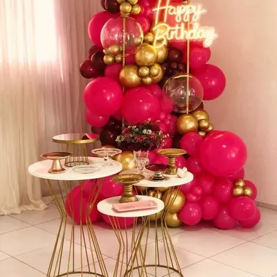This birthday decor is all about making a bold statement. I used a vibrant mix of hot pink, maroon, and gold balloons to create a rich and energetic backdrop, with a neon sign and modern dessert tables to complete the chic look.