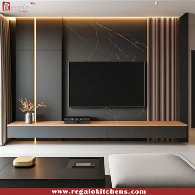 A dramatic and sophisticated TV unit. We combined dark, textured panels with a wood-finish console and integrated vertical lighting for a moody, cinematic feel.