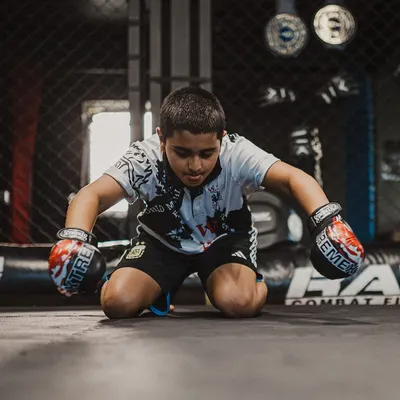 A young warrior performs the Wai Kru, a traditional ritual showing respect to his teachers and the art of Muay Thai. This is where discipline begins.