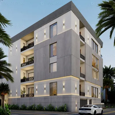 An angular view of the 280 sq. yard Kirti Nagar residence, highlighting the interplay of different facade materials and the strategic placement of lighting to create a dynamic look.