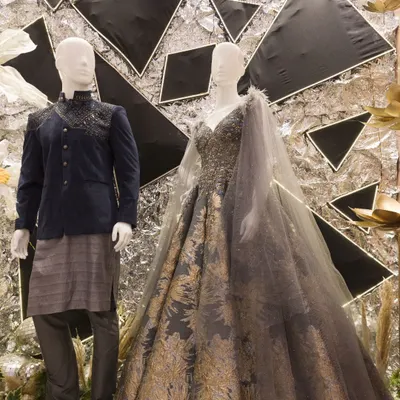 A showcase of our collaboration with bridal apparel brand Samyakk. This setup features a modern, edgy backdrop with mannequins dressed in a glamorous gown and a stylish bandhgala.