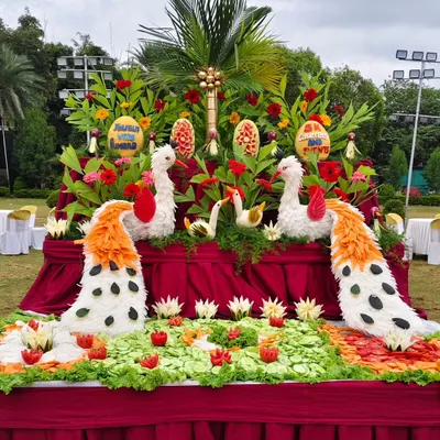 Art you can eat. Our talented team creates stunning displays with vegetable and fruit carvings, like these beautiful peacocks, adding a unique touch to your buffet setup.