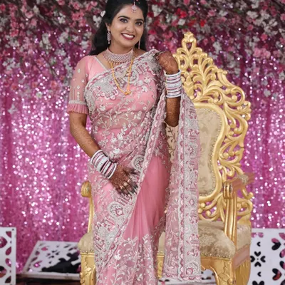 This bride is ready for her reception, shining in our sparkling AD jewellery set. The intricate design of the necklace adds a touch of modern glamour that is perfect for an evening of celebration.
