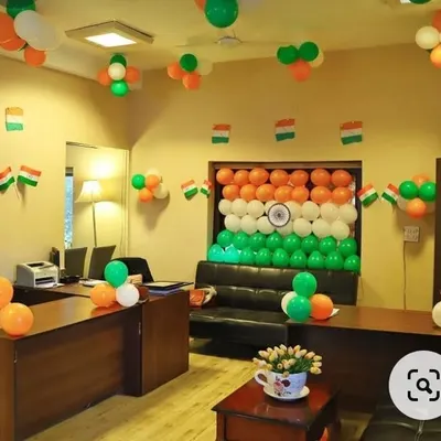 Here is a full office decoration I did for Independence Day. The main feature is a large backdrop of the Indian flag made entirely of saffron, white, and green balloons, complete with a printed Ashoka Chakra in the center. I also added smaller balloon clusters and flag bunting throughout the room.