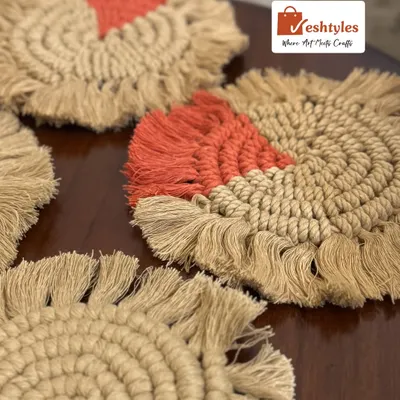 My colorful table coasters are a great way to add a pop of color to your coffee table. This set features a mix of jute with orange accents.