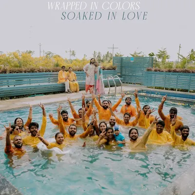 "Wrapped in colors, soaked in love." The entire wedding party takes the Haldi celebration to the pool for an unforgettable day of fun.