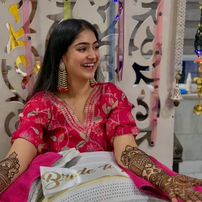 My intimate mehendi at home was an emotional and happy night. I chose this comfy and vibrant pink printed suit with statement earrings, allowing me to dance and enjoy the surprise party my friends threw.
