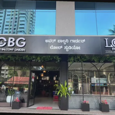 The beautiful storefront of our new location, a collaboration between Our Balcony Garden and LOL Studio. The signage, featuring both English and Kannada, welcomes everyone to explore our collections.