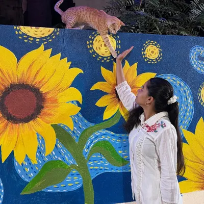 The completed 'Starry Night with Sunflowers' mural. This large-scale piece combines two of Van Gogh's most famous elements into one unique work of art.